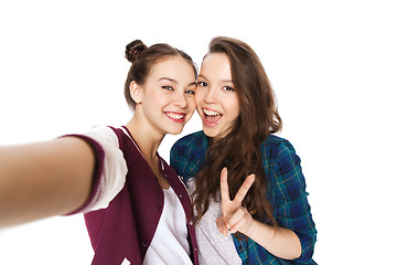Image showing happy friends taking selfie and showing peace