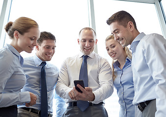 Image showing happy businesspeople with smartphone