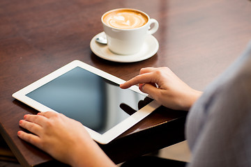 Image showing close up of woman with tablet pc and coffee