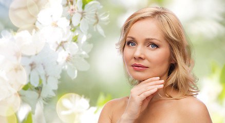 Image showing woman with bare shoulders touching face