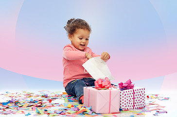 Image showing happy little baby girl with birthday presents