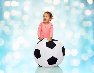 Image showing happy mulatto little baby girl playing with ball