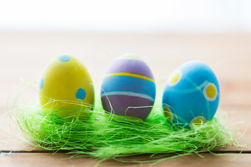 Image showing close up of colored easter eggs and grass