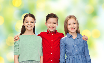 Image showing happy boy and girls hugging