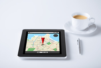 Image showing tablet pc with gps navigator map and cup of coffee