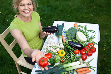 Image showing Cute blond girl with vegetables