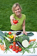 Image showing Cute blond girl with vegetables