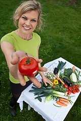 Image showing Cute blond girl with vegetables