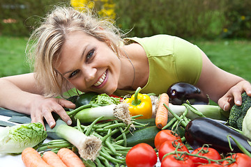 Image showing Cute blond girl with vegetables