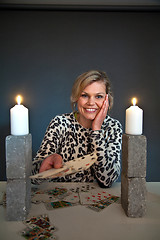 Image showing Cute blond girl shot in studio candles