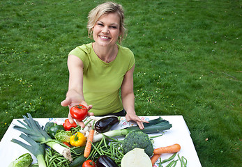 Image showing Cute blond girl with vegetables