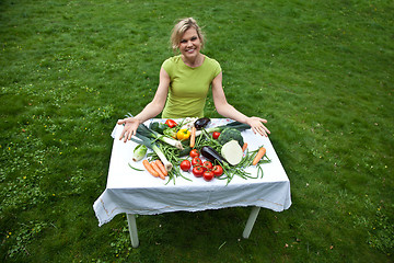 Image showing Cute blond girl with vegetables