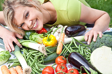 Image showing Cute blond girl with vegetables