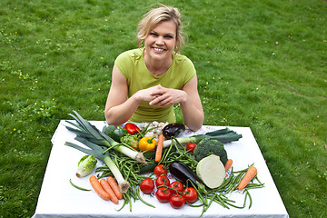 Image showing Cute blond girl with vegetables