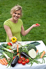 Image showing Cute blond girl with vegetables