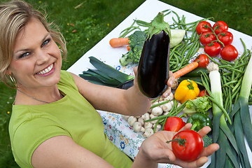 Image showing Cute blond girl with vegetables