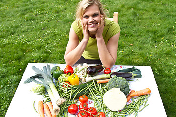 Image showing Cute blond girl with vegetables