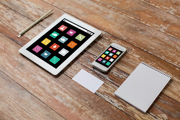 Image showing close up of notebook, tablet pc and smartphone