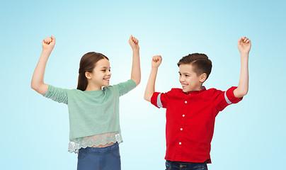 Image showing happy boy and girl celebrating victory