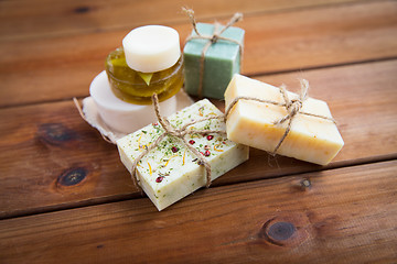 Image showing close up of handmade soap bars on wood