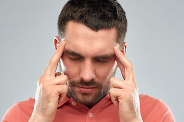 Image showing man suffering from head ache or thinking