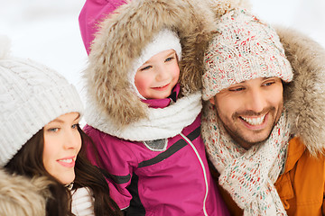 Image showing happy family with child in winter clothes outdoors