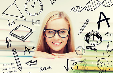 Image showing student with stack of books and doodles