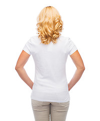 Image showing woman in blank white t-shirt from back