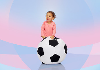 Image showing happy mulatto little baby girl playing with ball