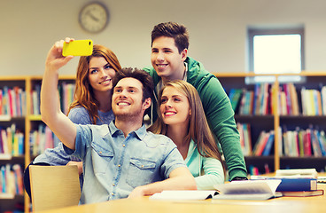 Image showing students with smartphone taking selfie in library