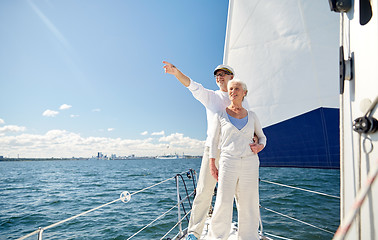 Image showing senior couple sailing on boat or yacht in sea