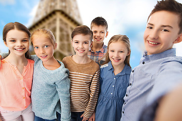 Image showing happy children talking selfie over eiffel tower