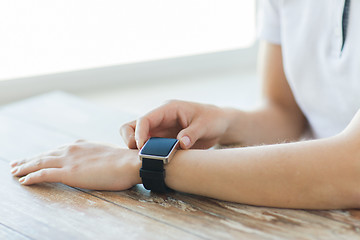 Image showing close up of hands setting smart watch