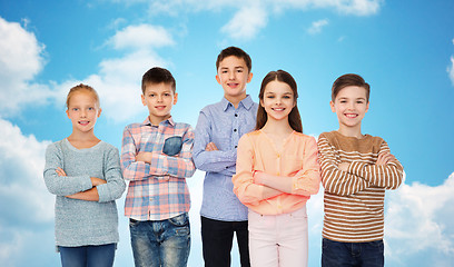 Image showing happy smiling children over blue sky