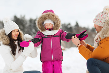 Image showing happy family with child in winter clothes outdoors