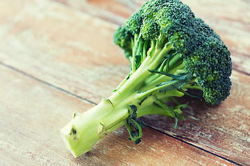 Image showing close up of broccoli on wooden table
