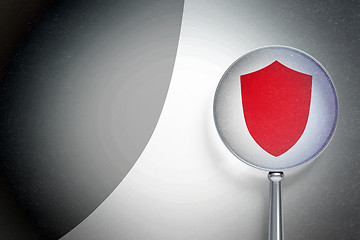 Image showing Privacy concept:  Shield with optical glass on digital background