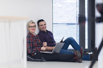 Image showing startup business, couple working on laptop computer at office