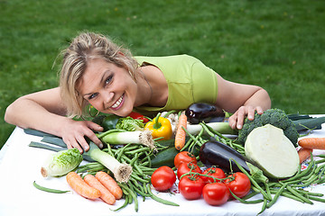 Image showing Cute blond girl with vegetables