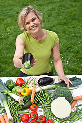 Image showing Cute blond girl with vegetables