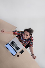 Image showing top view of young business woman working on laptop