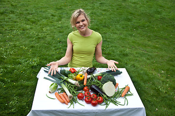 Image showing Cute blond girl with vegetables