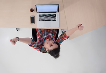 Image showing top view of young business woman working on laptop