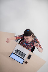 Image showing top view of young business woman working on laptop