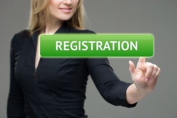 Image showing business, technology, internet and networking concept - woman pressing registration button on virtual screens