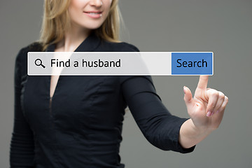 Image showing woman presses button in the browser -  find a husband. technology and internet concept. 