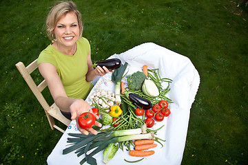 Image showing Cute blond girl with vegetables