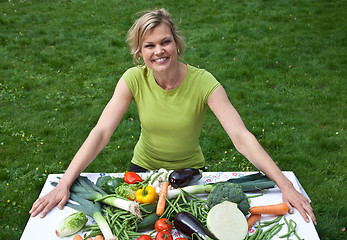 Image showing Cute blond girl with vegetables