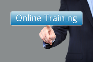 Image showing technology, internet and networking concept - businessman pressing online training button on virtual screens