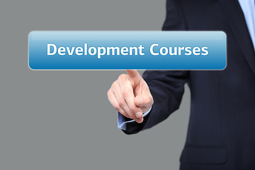 Image showing technology and internet  concept - businessman pressing development courses button on virtual screens